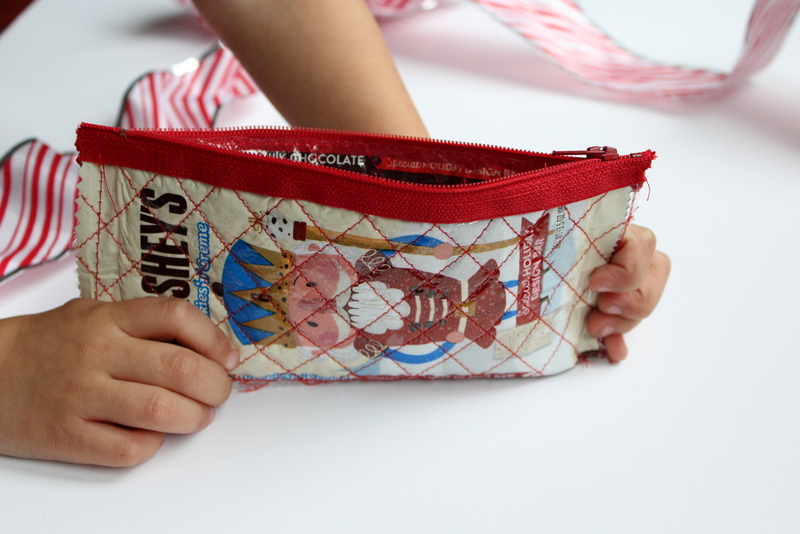 Candy Wrapper Gift Card Wallet Tutorial: This tutorial lets you eat lots of delicious candy! Use the wrappers to create a cute gift card wallet to fill with gift cards and gift to your favorite person! Click through for the full sewing tutorial. | www.sewwhatalicia.com