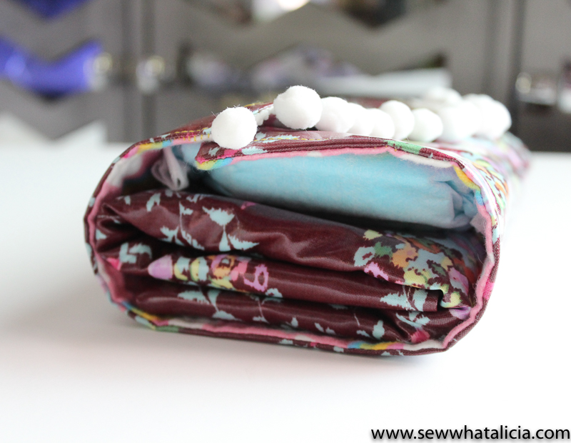 How to Sew A Diaper Clutch and Waterproof Changing Mat: This is a fun tutorial for a stylish diaper clutch and a waterproof changing mat using oilcloth. Click through for the full tutorial | www.sewwhatalicia.com