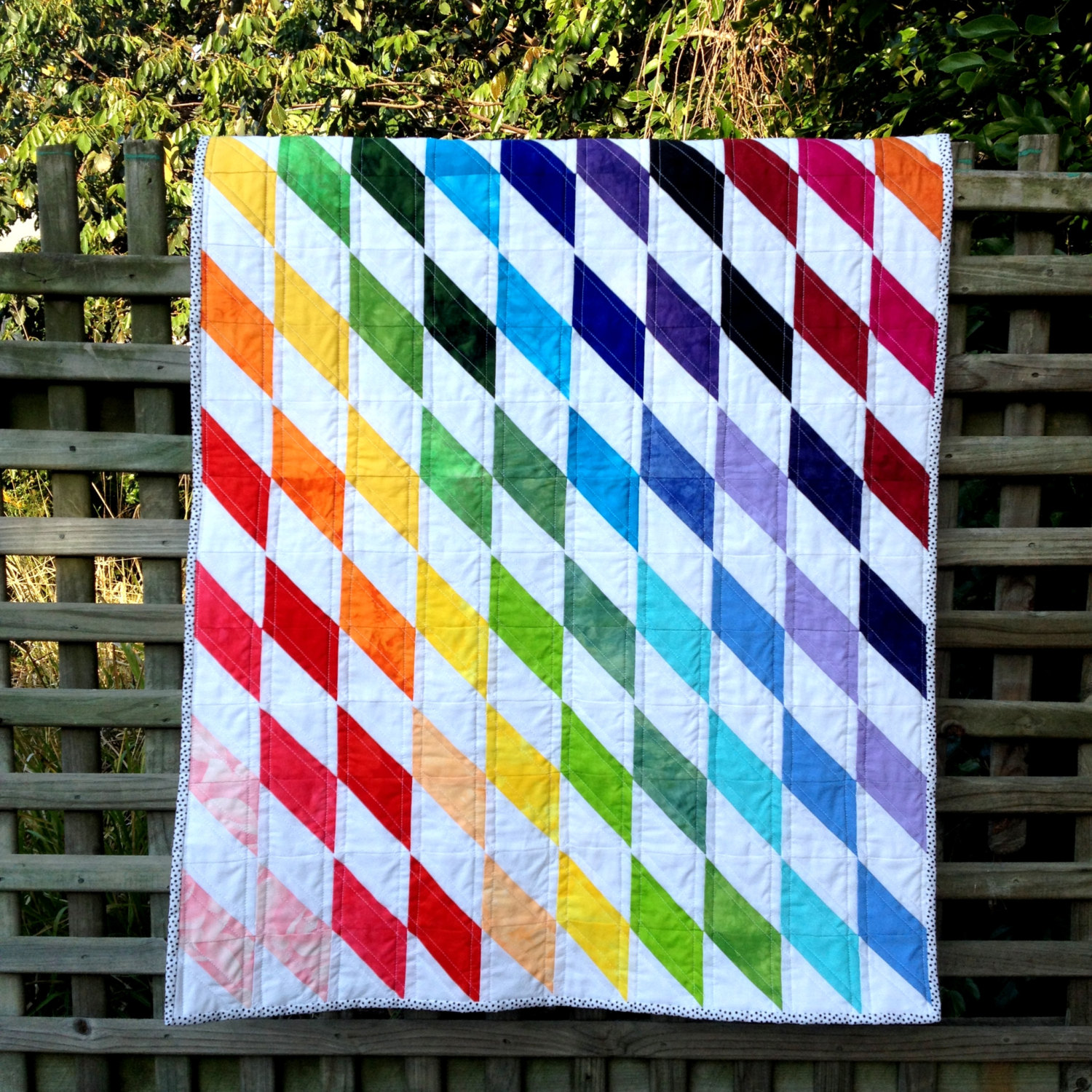 10+ Fabulous Rainbow Quilt Patterns: These rainbow quilt patterns will give you all sorts of fabulous feelings! I just love a fun rainbow don't you? Click through for the full list of rainbow quilt patterns to sew. | www.sewwhatalicia.com