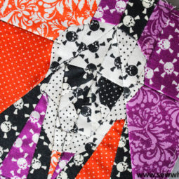 Skull Quilt Block Paper Piecing Pattern: This is a great paper piecing tutorial for Halloween! This sewing tutorial is perfect for those who love to paper piece. Click through for the tutorial and a video walkthrough. | www.sewwhatalicia.com