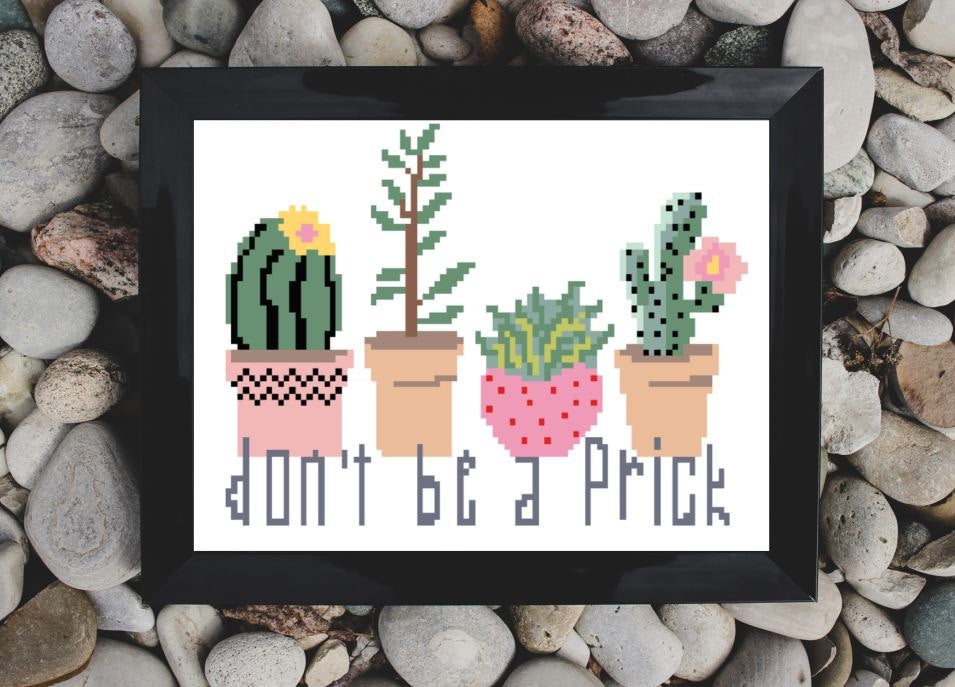 pictured cross stitch reading don't b a prick with four cactus framed on a rock background