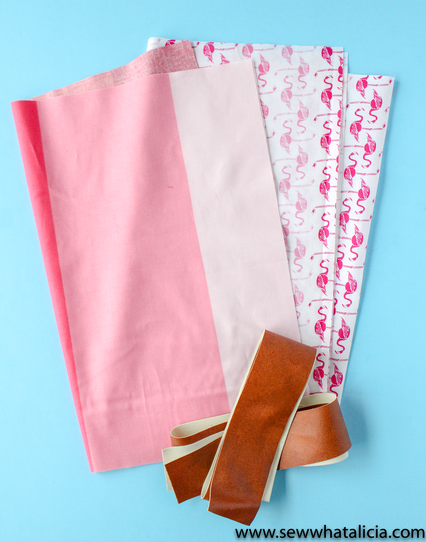 How to Make a Tote Bag: Supplies pictured, four pieces of fabric and two leather handles. | www.sewwhatalicia.com