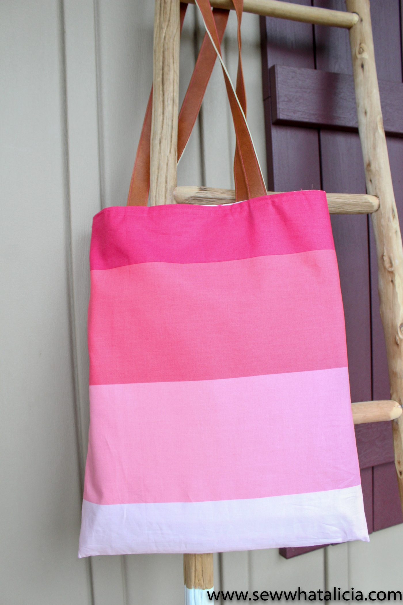 How to make a tote bag: Finished beauty shot of tote hanging on ladder. | www.sewwhatalicia.com