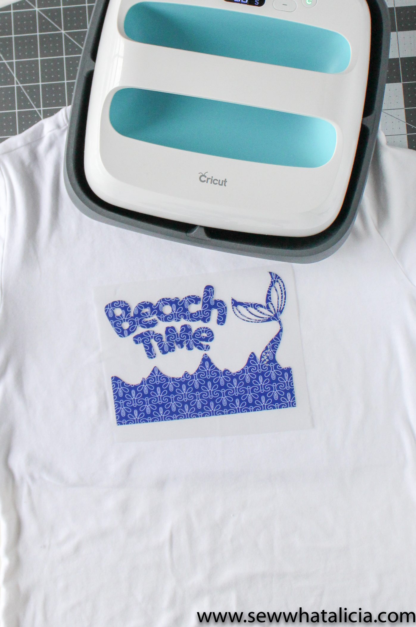 Cricut Patterned Iron On Tips and Tricks: Pictured beach design placed on shirt with Cricut EasyPress above. | www.sewwhatalicia.com