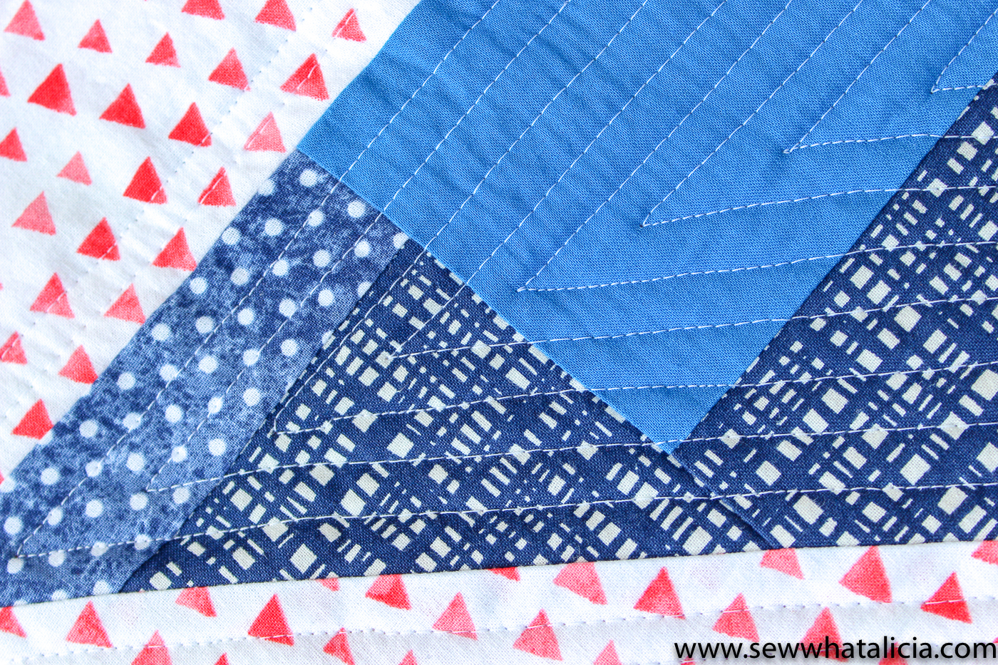 Scrappy Easy Rainbow Quilt Pattern and Tutorial: Pictured close up with straight line quilting highlighted. | www.sewwhatalicia.com