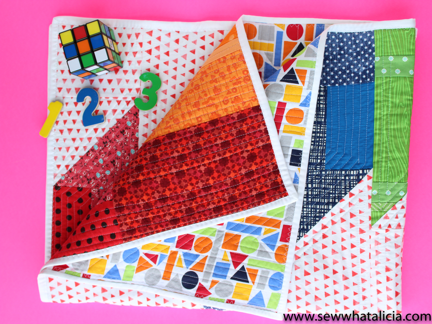 Scrappy Easy Rainbow Quilt Pattern and Tutorial: This easy sewing pattern is also a free sewing pattern. This beginner sewing tutorial is perfect for those who want to quilt a rainbow baby blanket to give as a gift. Click through for the free sewing pattern and a full tutorial. | www.sewwhatalicia.com