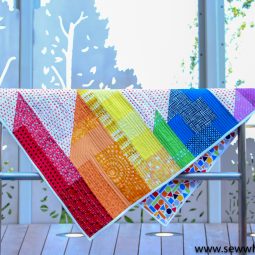 Scrappy Easy Rainbow Quilt Pattern and Tutorial: This easy quilt pattern is perfect for beginner sewing fanatics. Click through for the PDF pattern and all the instructions. | www.sewwhatalicia.com