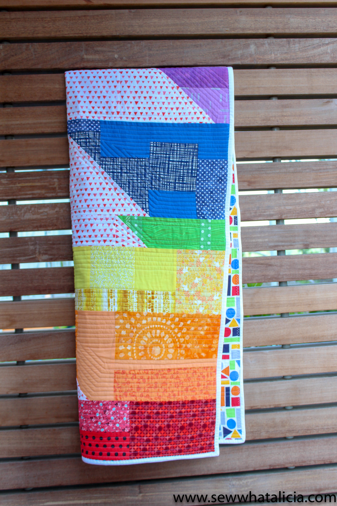 Scrappy Easy Rainbow Quilt Pattern and Tutorial: This easy sewing pattern is also a free sewing pattern. This beginner sewing tutorial is perfect for those who want to quilt a rainbow baby blanket to give as a gift. Click through for the free sewing pattern and a full tutorial. | www.sewwhatalicia.com