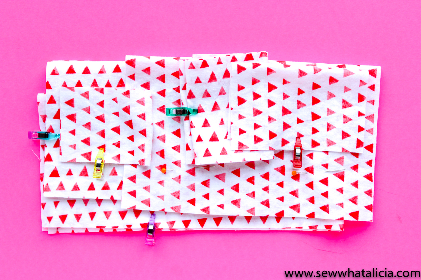 Scrappy Easy Rainbow Quilt Pattern and Tutorial: Pictured cut white pieces color coded with mini wonder clips. | www.sewwhatalicia.com