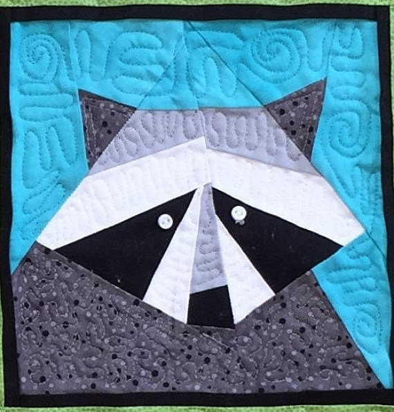 pictured finished raccoon quilt block