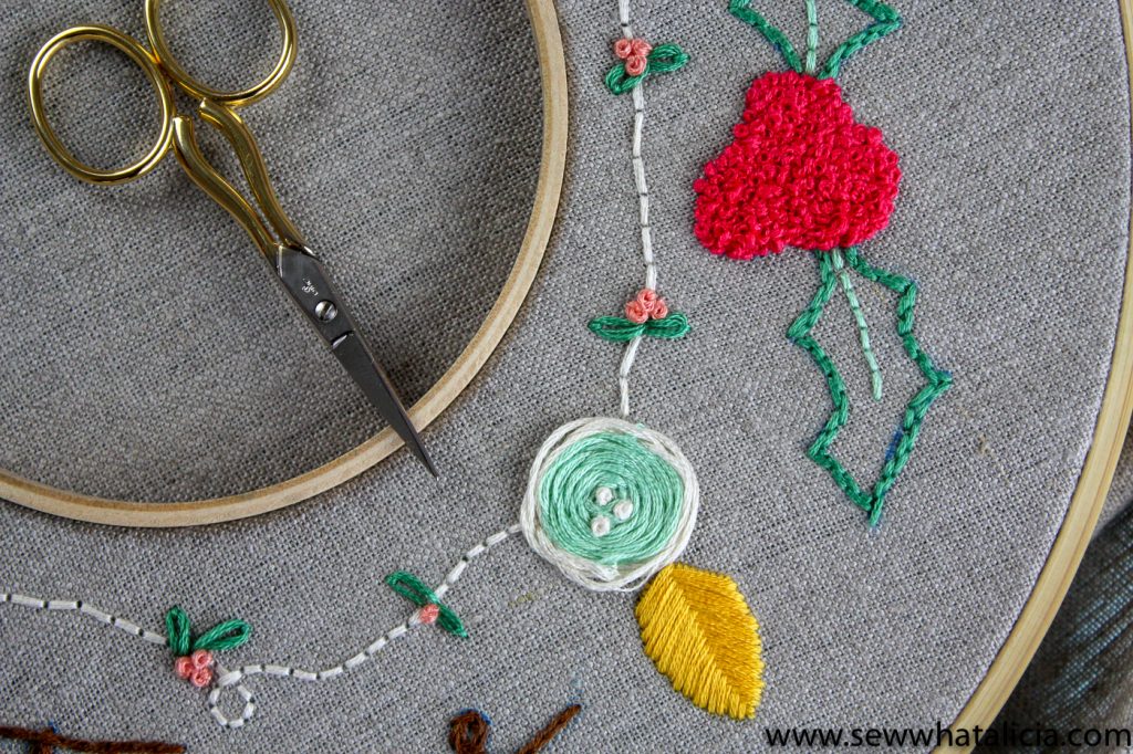 How to Embroider a Christmas Wreath: This Christmas wreath is so pretty! Learn how embroider this wreath with a walkthrough on all the different stitches used. Click through for the full tutorial and supply list. #sewwhatalicia #embroidery | www.sewwhatalicia.com