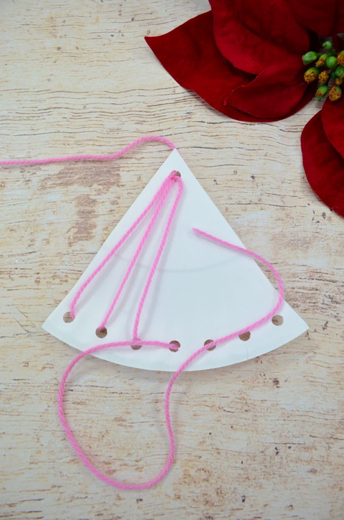 Easy Christmas Crafts for Kids - Angel Lacing Project: This holiday lacing project is a great introduction to sewing for kids. Click through for the full tutorial. | www.sewwhatalicia.com