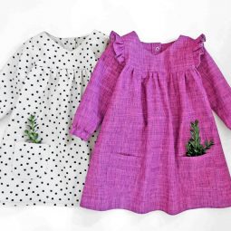 pictured pink dress and white dress with greenery in pockets