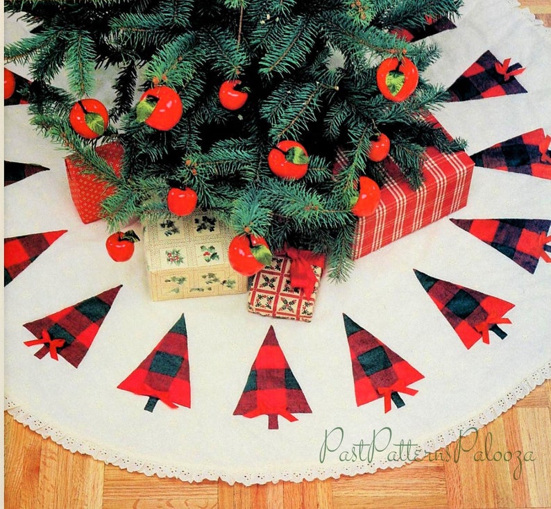 Christmas tree skirt with buffalo plaid trees and trimmed with lace